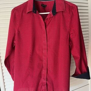 A Talbots wrinkle resistant blouse. 96% cotton, 4% spandex. Details on the neck.